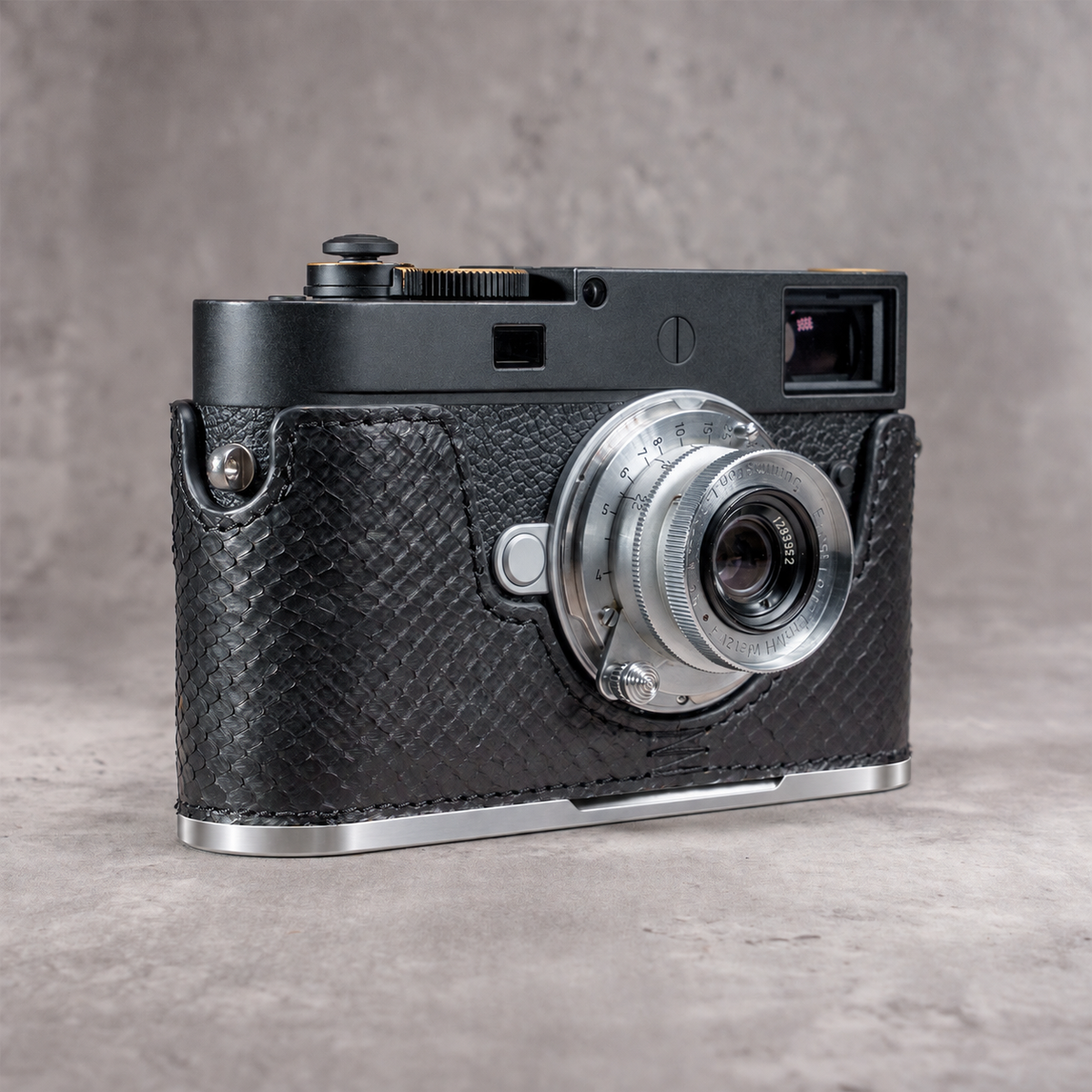 Black python FlexCase on a Leica M11 with the Silver Chrome plate, bright edge below the leather