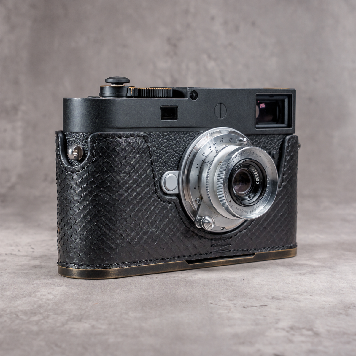 Black python FlexCase on a Leica M11 with the Black Patina plate, dark aged edge below the leather