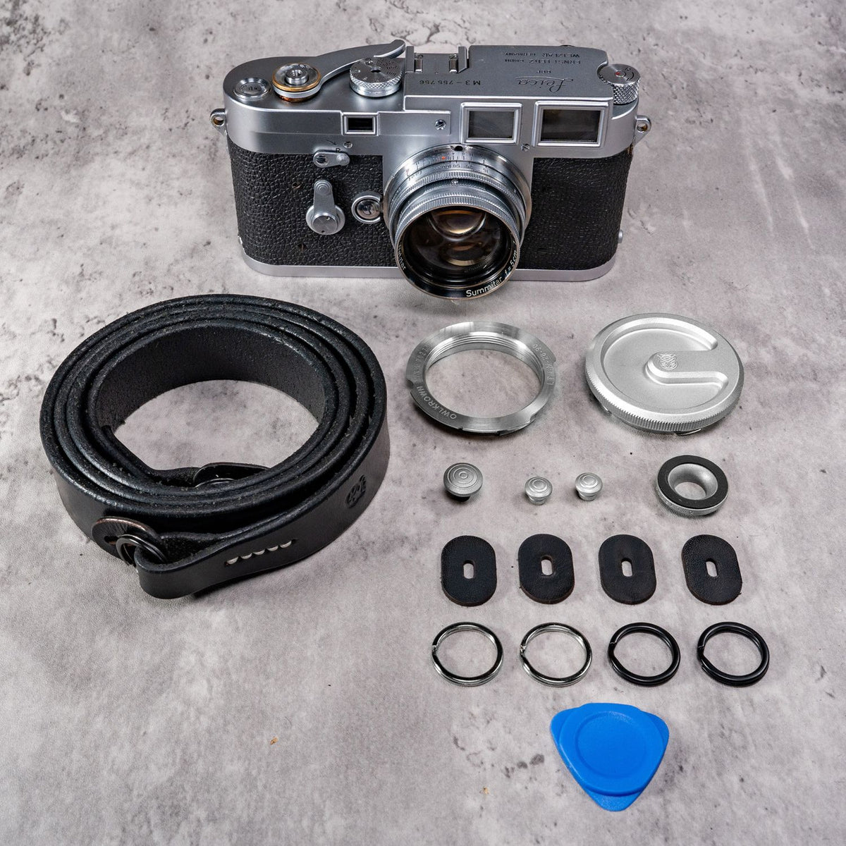 Film M Kit for Leica in Silver Chrome, laid out with the Helliot Monochrome leather strap