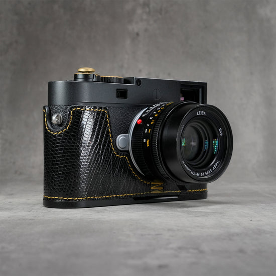 Black gloss lizard FlexCase on a Leica M11, front three-quarter view from the right