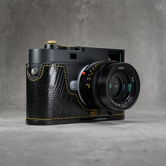 Black ring lizard FlexCase on a Leica M11, front three-quarter view from the right