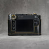 Back view of the camera in a black gloss lizard FlexCase, straight on