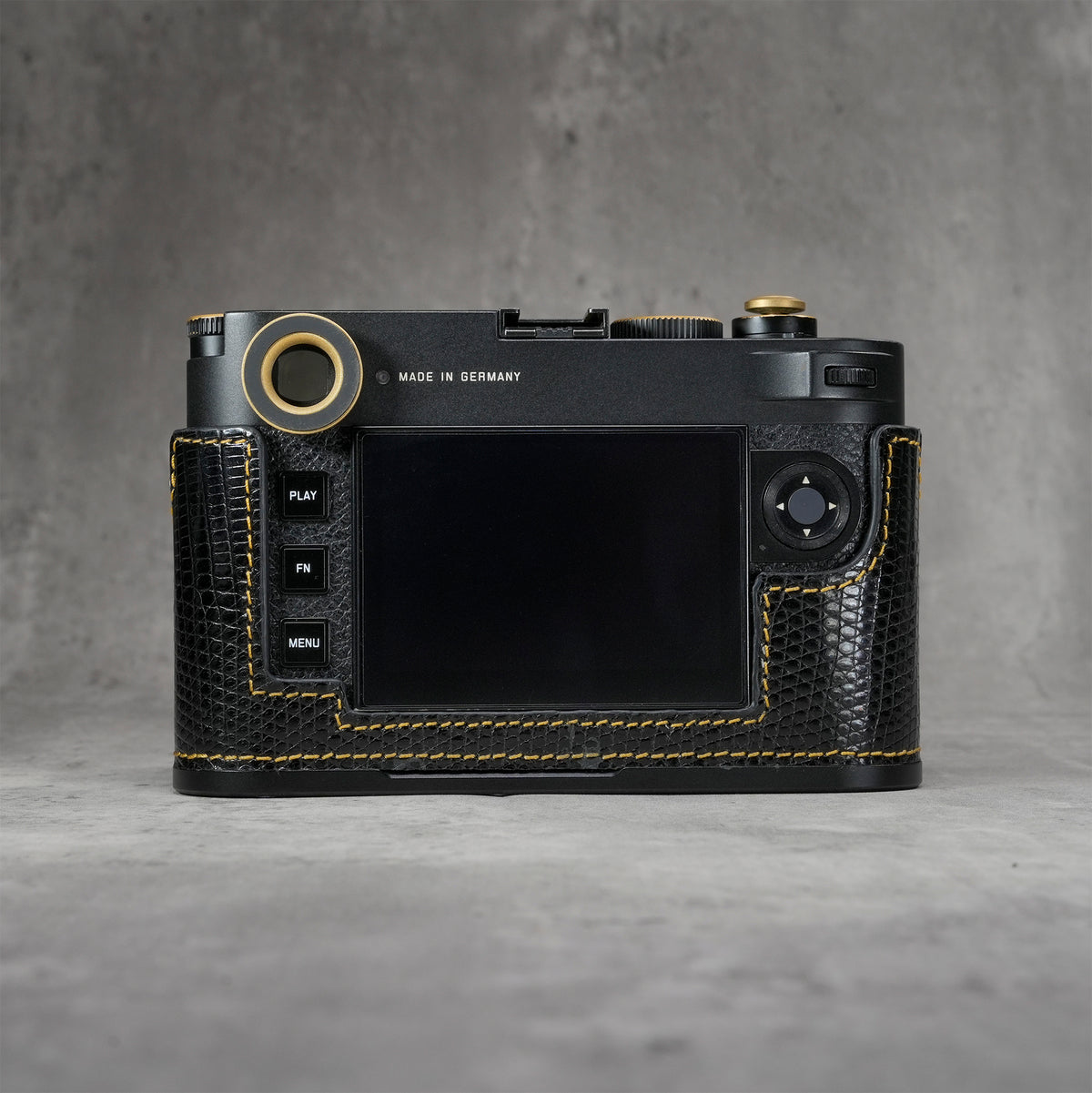 Back view of the camera in a black gloss lizard FlexCase, straight on
