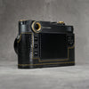 Back three-quarter view of the camera in a black gloss lizard FlexCase