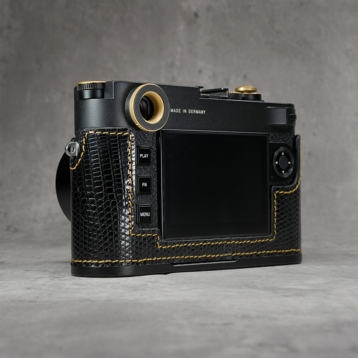 Back three-quarter view of the camera in a black gloss lizard FlexCase