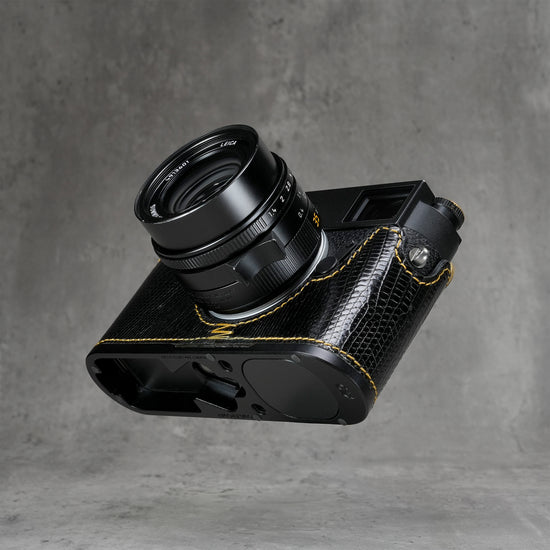 Underside of the black gloss lizard FlexCase on a Leica M11, base plate cutouts showing