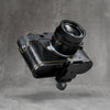 Arca clamp mounted to the concealed profile in the Black Chrome base plate of the black gloss lizard FlexCase