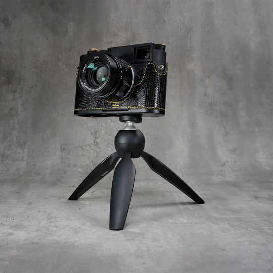 Leica M11 in a black gloss lizard FlexCase mounted on a tabletop tripod