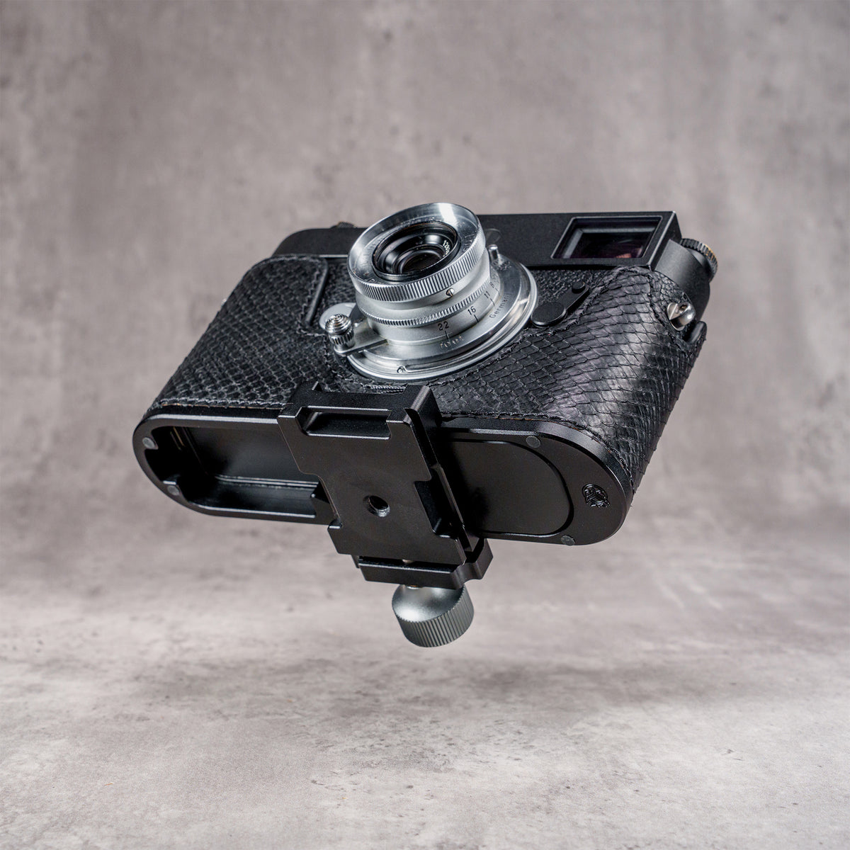 Arca clamp mounted to the concealed profile in the black python FlexCase base plate