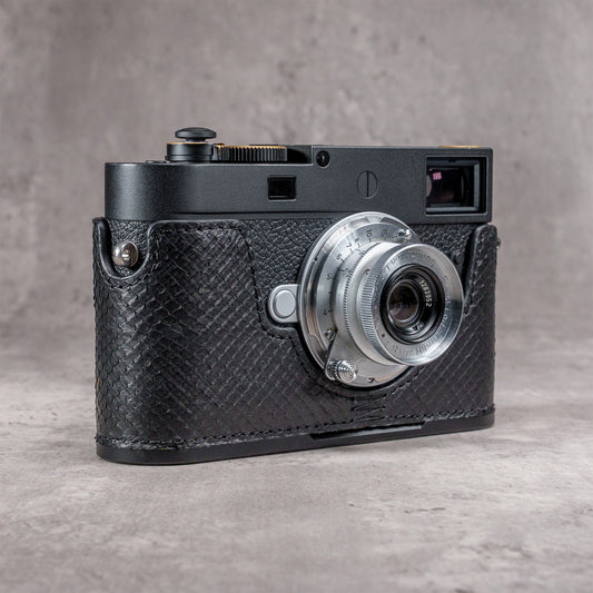 Leica M11 in a black python FlexCase, front view on a grey studio backdrop