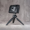 Leica M11 in a black python FlexCase mounted on a tabletop tripod