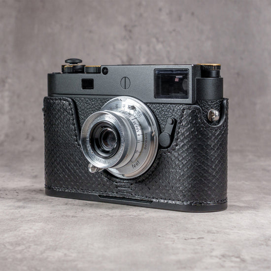 Leica M11 in a black python FlexCase, front three-quarter view with the lens forward
