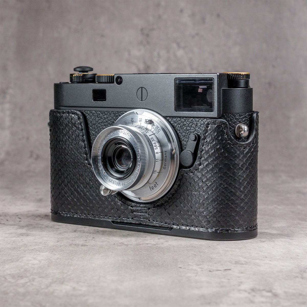 Leica M11 in a black python FlexCase, front three-quarter view with the lens forward