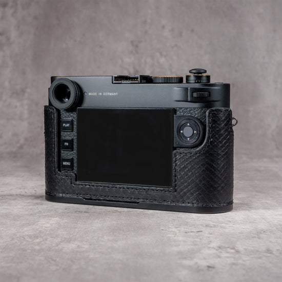 Back of the camera in a black python FlexCase, screen and controls clear of the leather