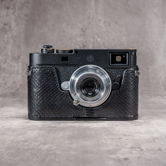 Black python FlexCase on a Leica M11, front view with the strap lug showing