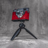 Leica M11 in a red python FlexCase mounted on a tabletop tripod