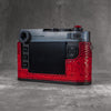 Back three-quarter view of the camera in a red python FlexCase