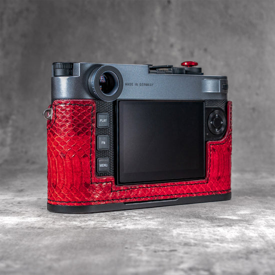 Back three-quarter view of the camera in a red python FlexCase, from the right