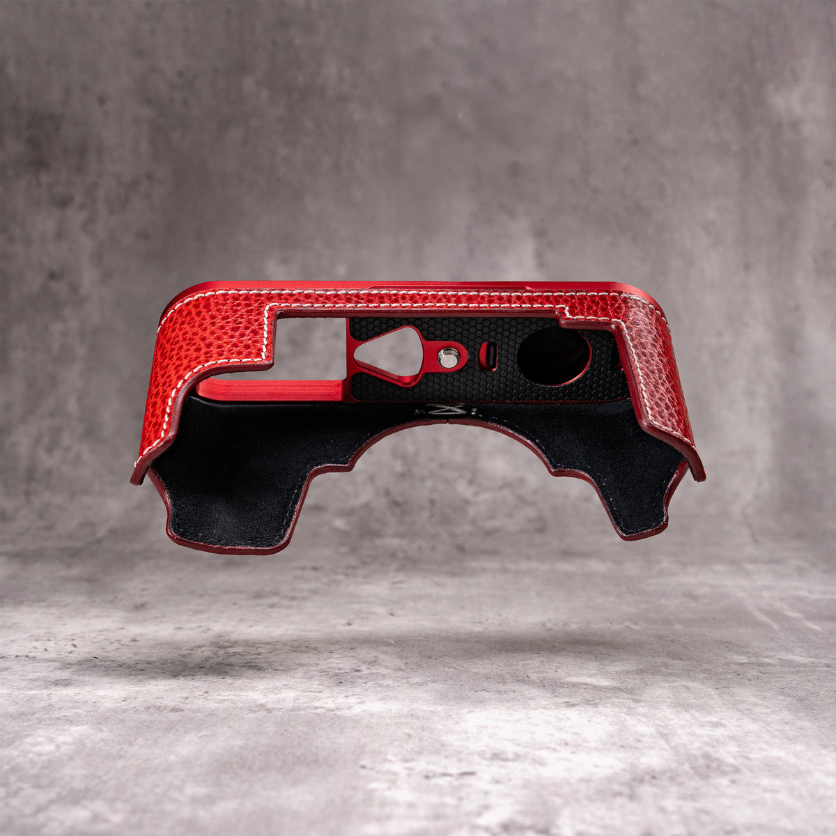 Inside of the Ruby Gloss FlexCase, showing the lining and the cutouts in the base plate