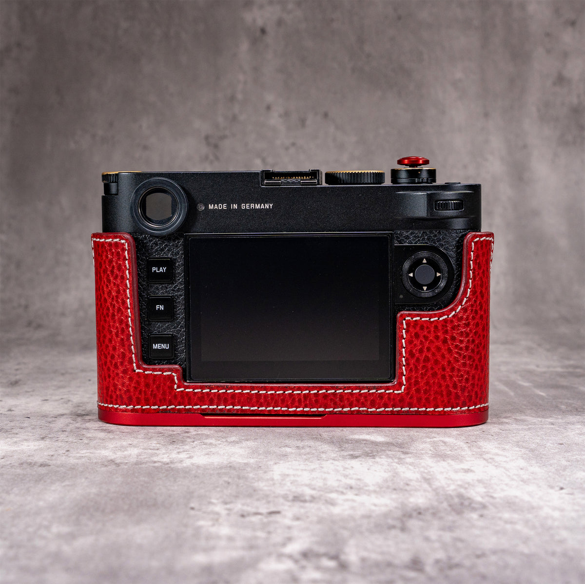 Rear view of the Ruby Gloss FlexCase on a Leica M11, showing the cutaway around the screen and buttons