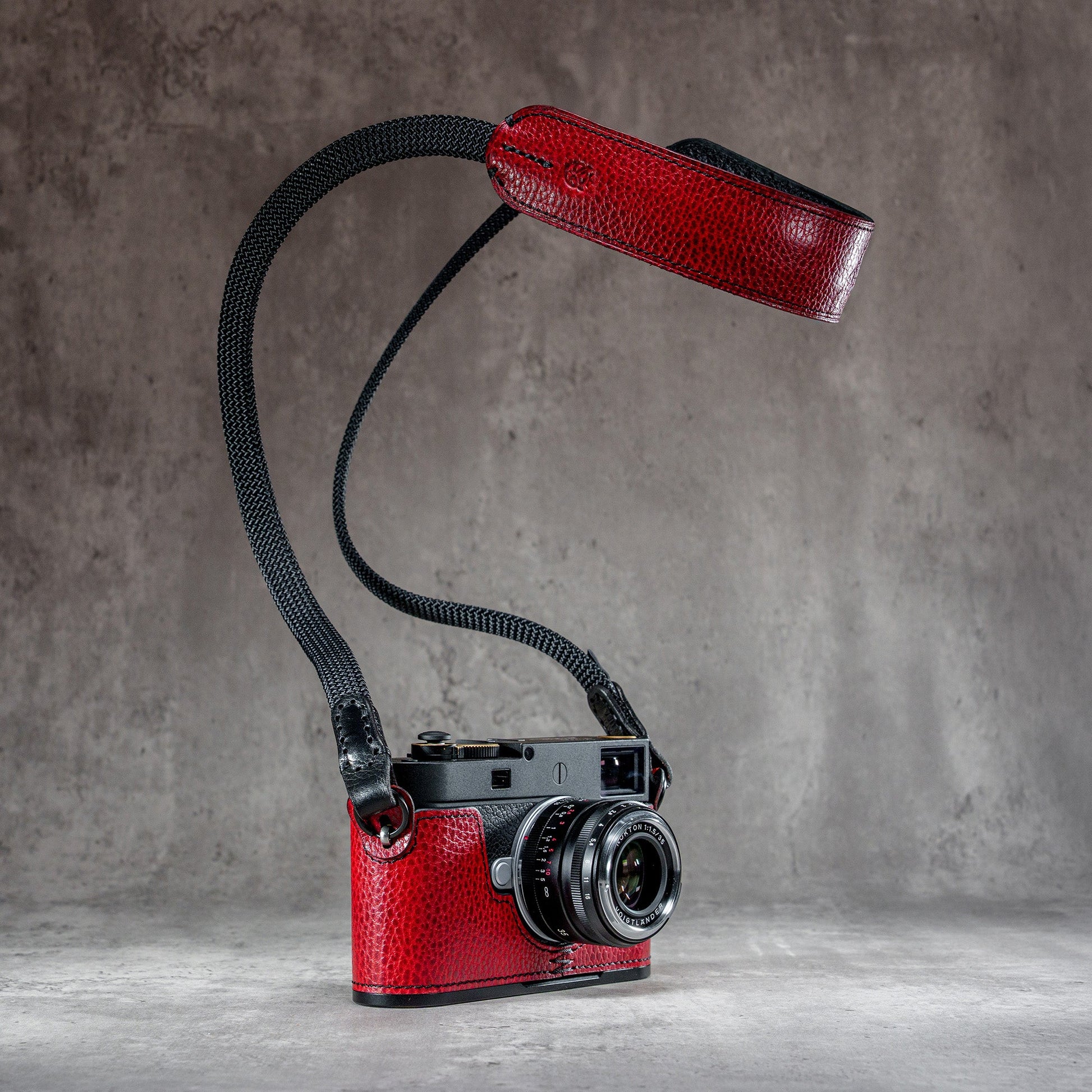 The Ruby Gloss FlexCase on a Leica M with the matching Classic Flat Padded Rope camera strap