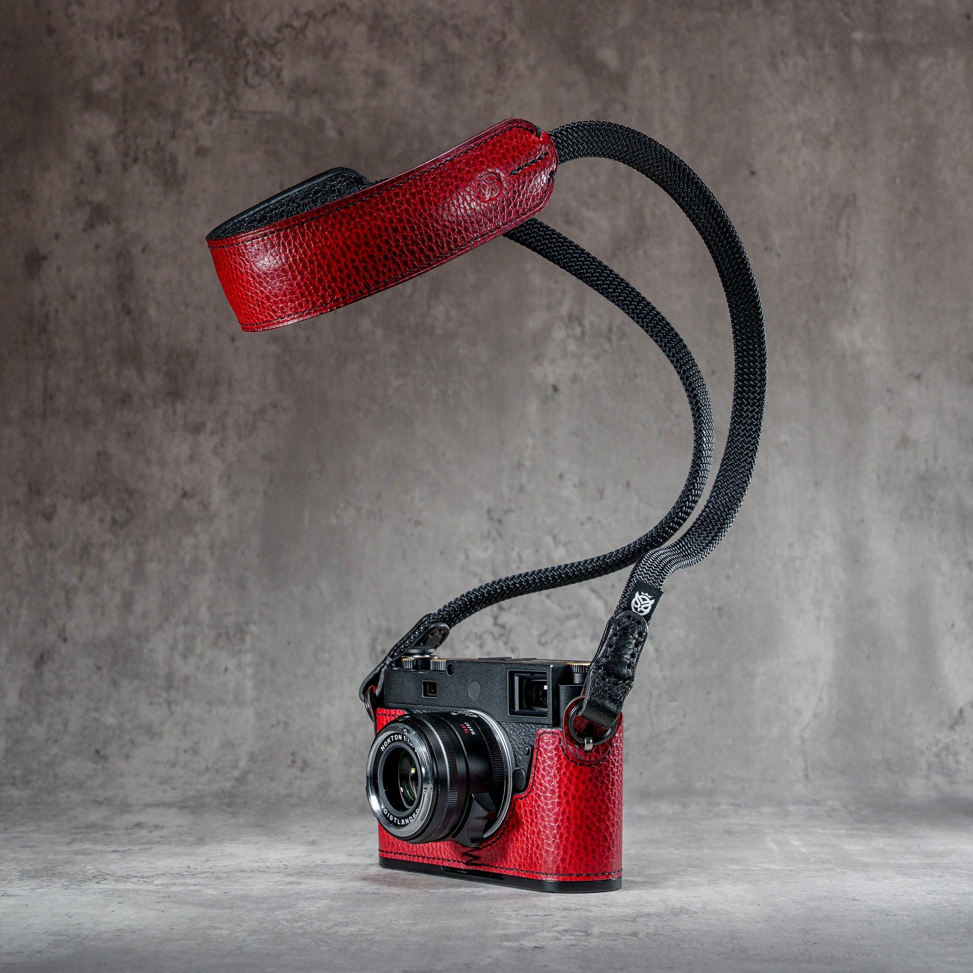 The Ruby Gloss FlexCase on a Leica M with the matching Classic Flat Padded Rope camera strap