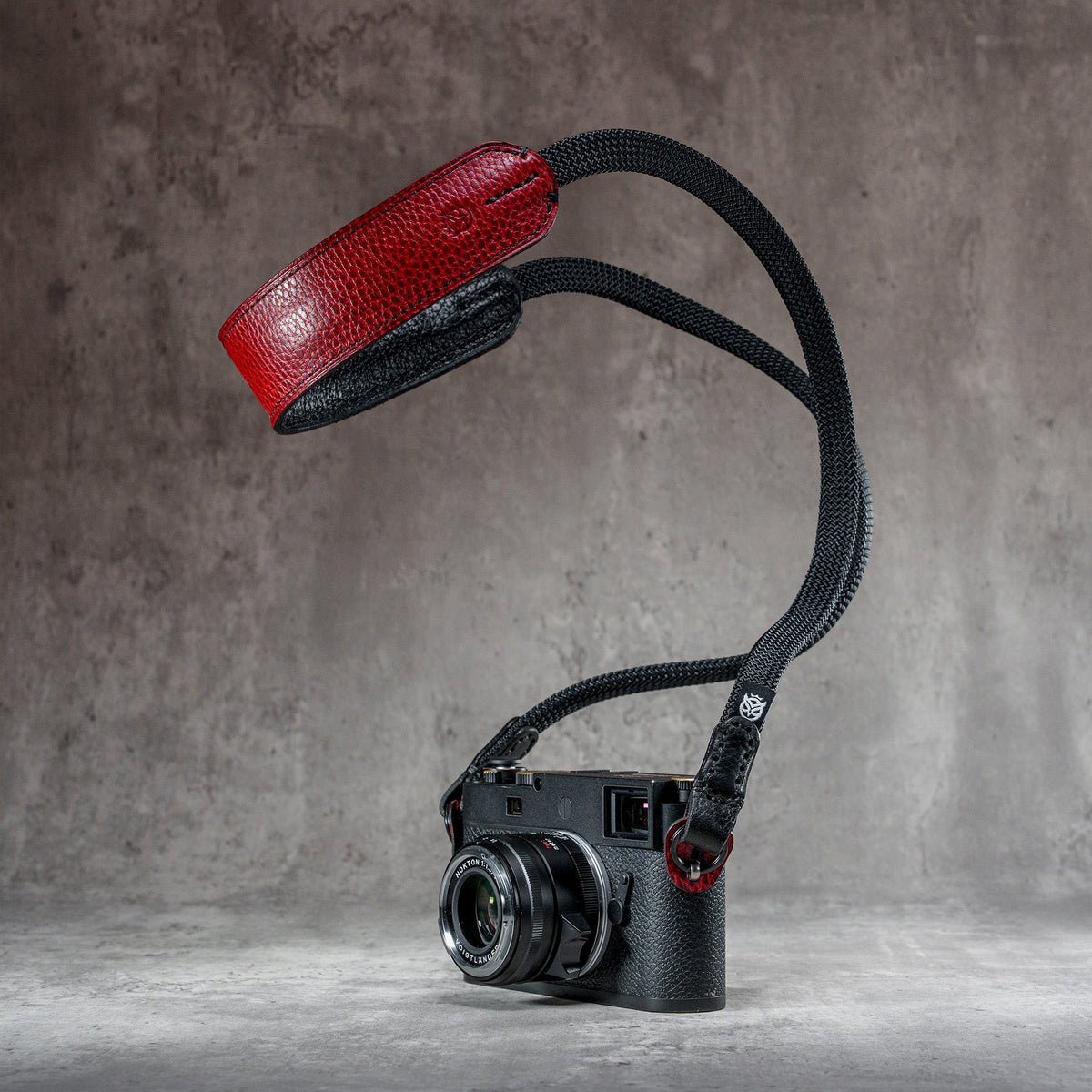 The Ruby Gloss FlexCase on a Leica M with the matching Classic Flat Padded Rope camera strap