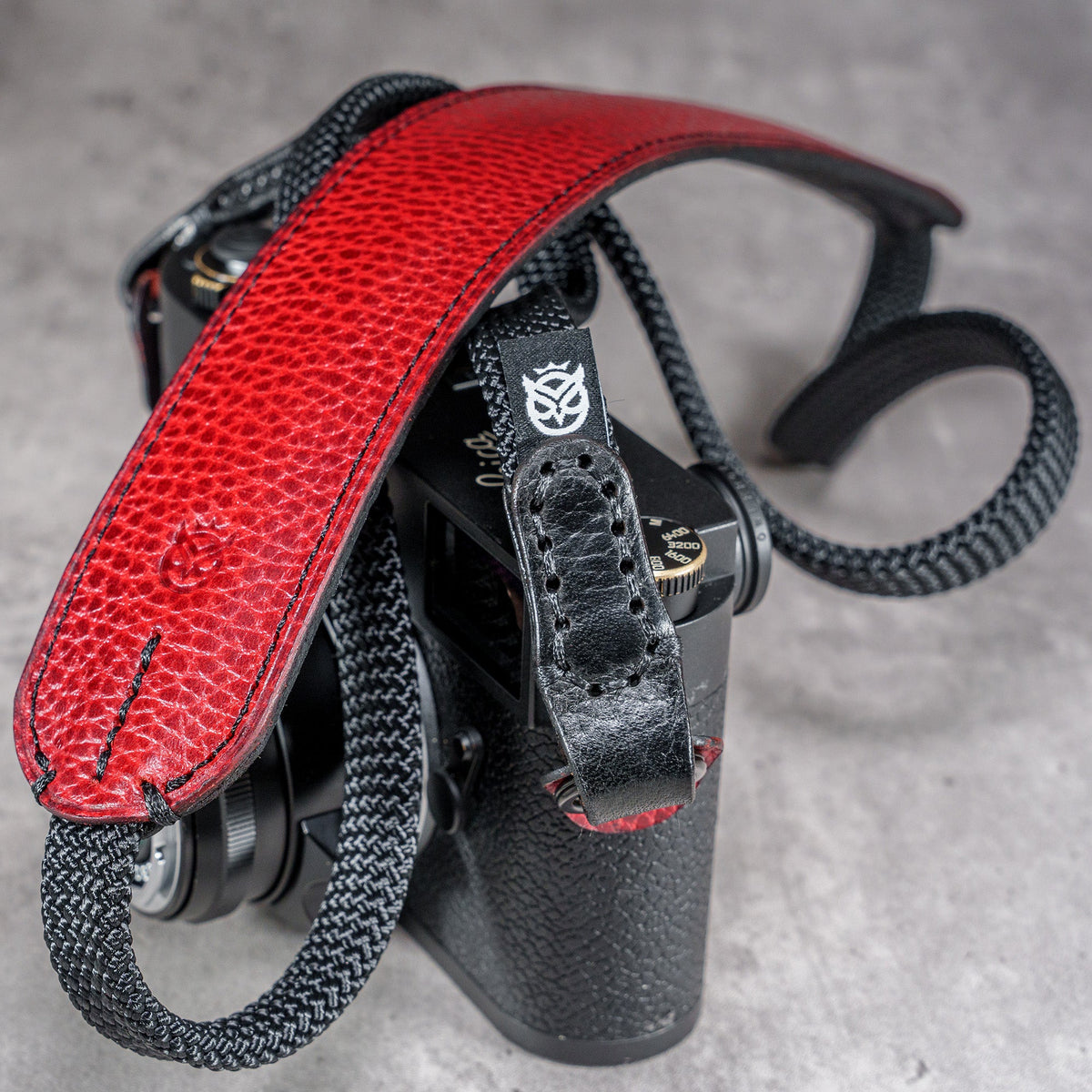The Ruby Gloss FlexCase on a Leica M with the matching Classic Flat Padded Rope camera strap