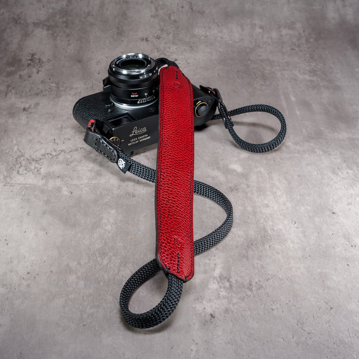 The Ruby Gloss FlexCase on a Leica M with the matching Classic Flat Padded Rope camera strap