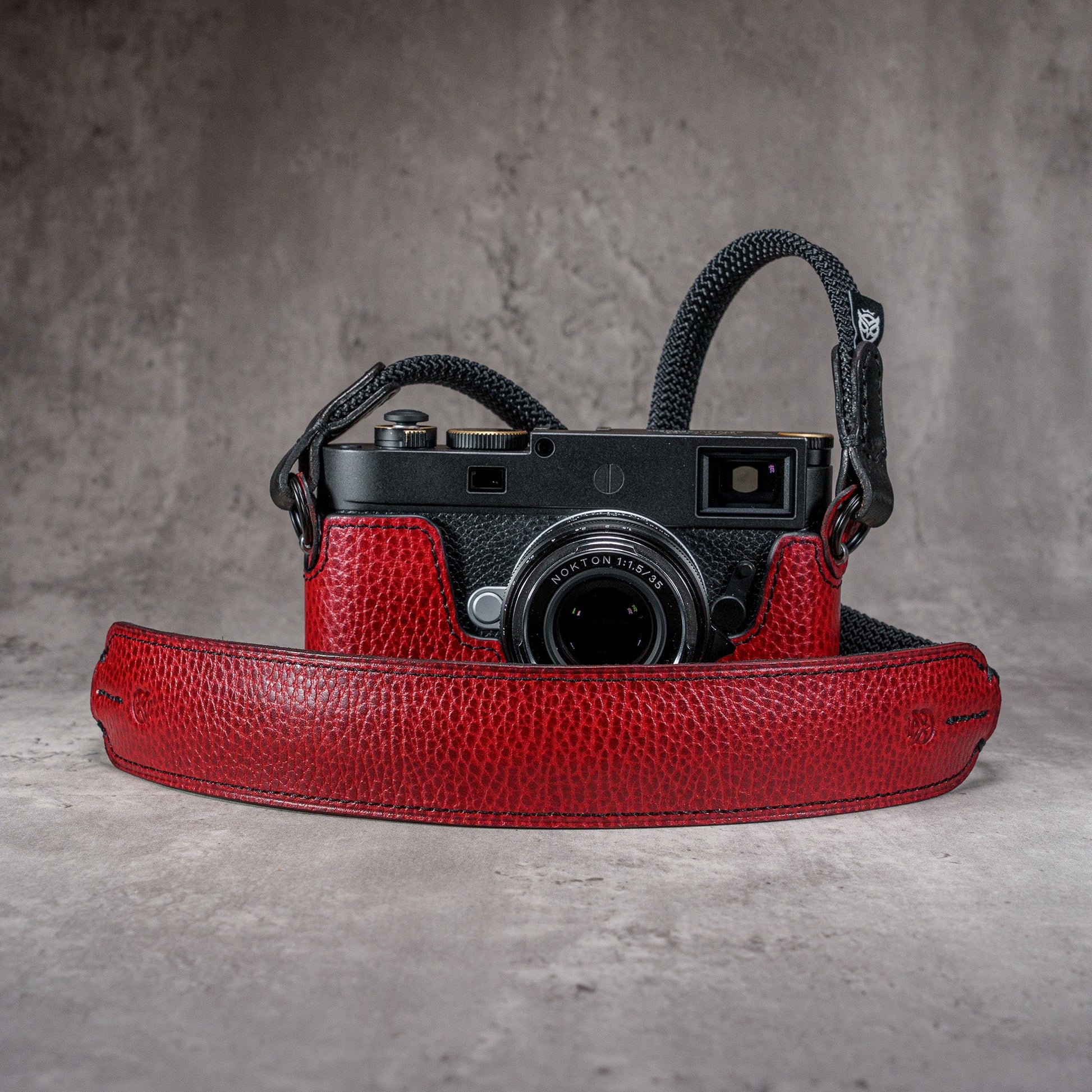 The Ruby Gloss FlexCase on a Leica M with the matching Classic Flat Padded Rope camera strap
