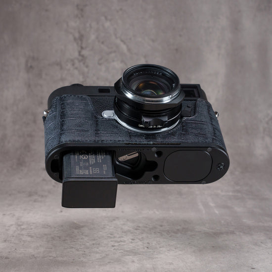 Black Swamp FlexCase from below with the battery half out, no need to remove the case