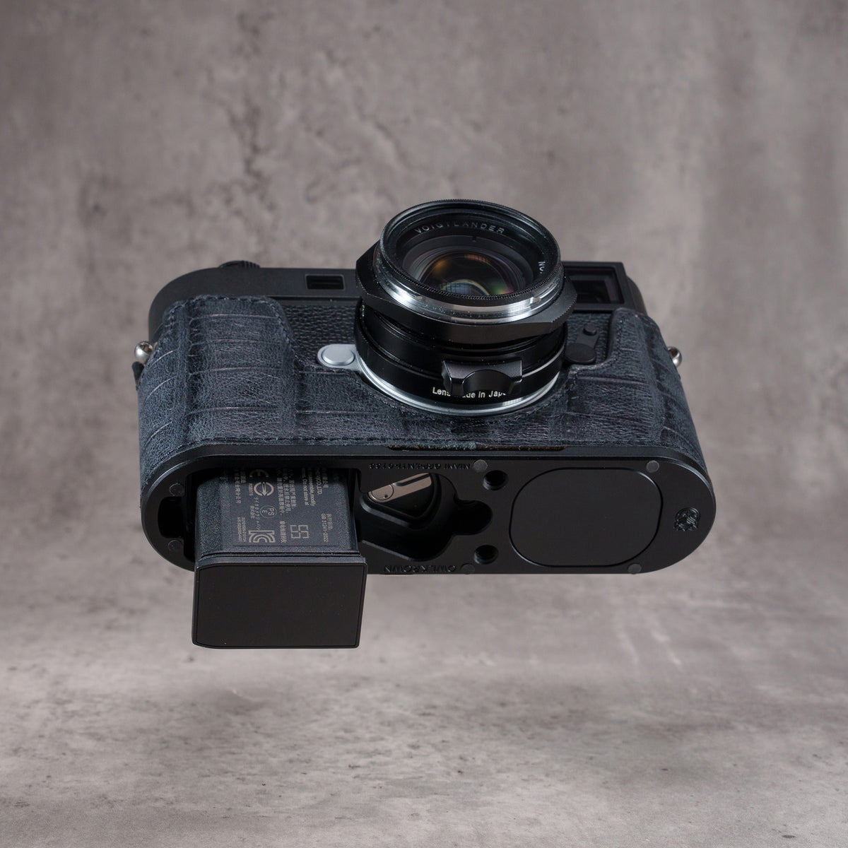 Black Swamp FlexCase from below with the battery half out, no need to remove the case