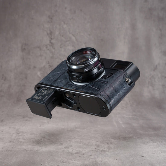 Black Swamp FlexCase from the right with the battery pulled out through the base plate