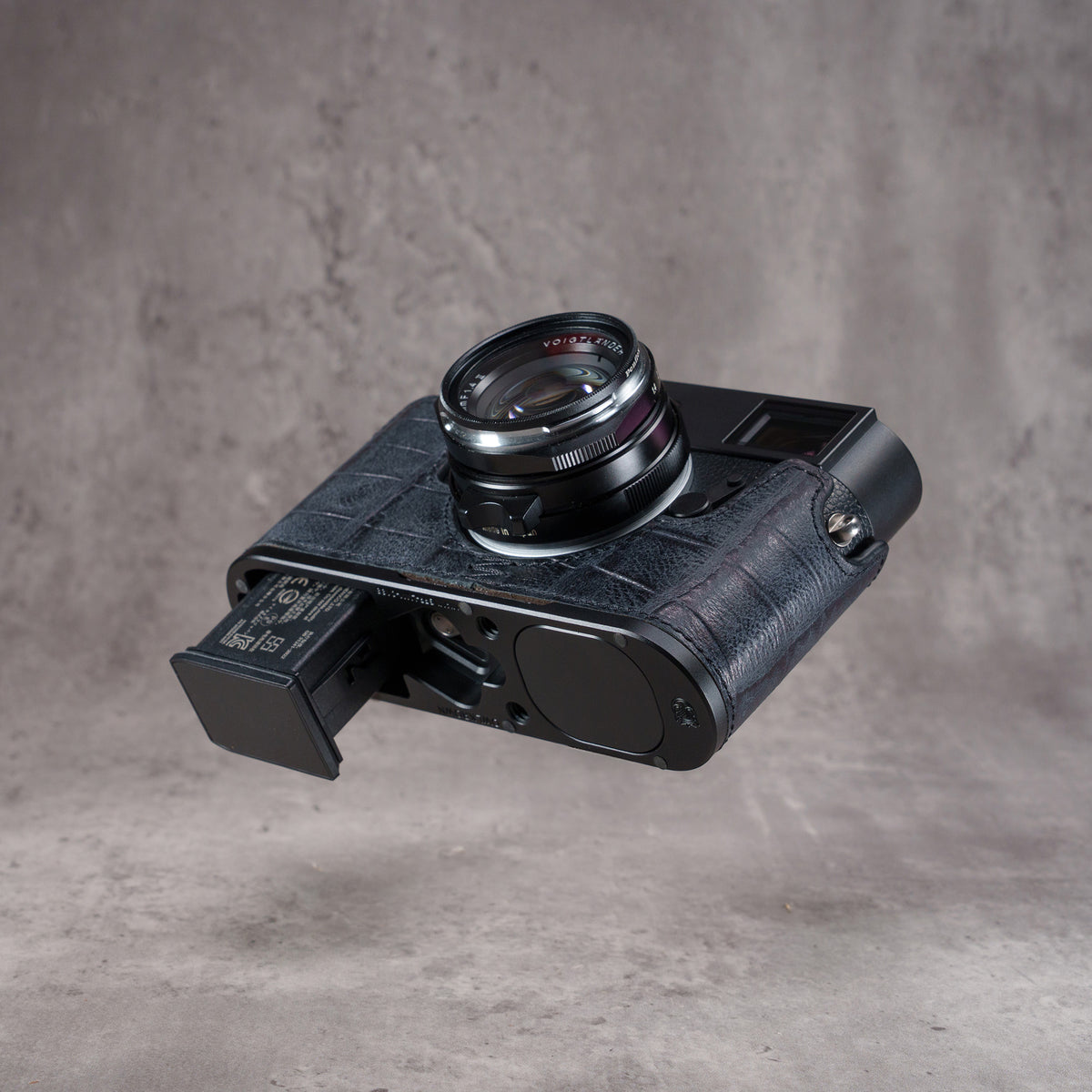 Black Swamp FlexCase from the right with the battery pulled out through the base plate