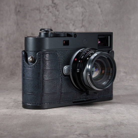 Black Swamp FlexCase on a Leica M camera, front three-quarter view from the right with the lens forward