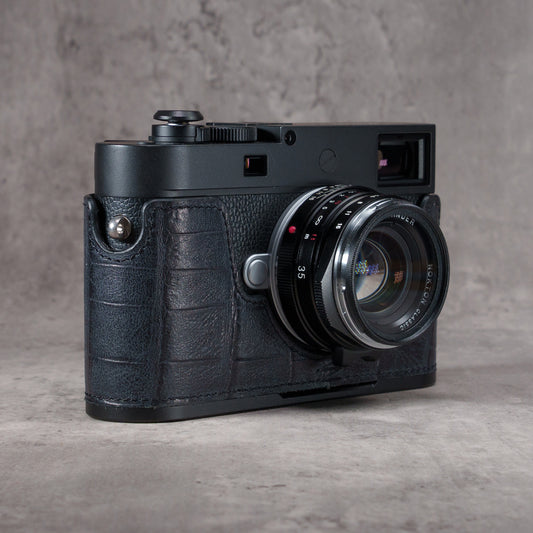 Black Swamp FlexCase on a Leica M camera, front three-quarter view from the right with the lens forward