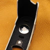 AirTag seated in the brass plate compartment of the Python FlexCase
