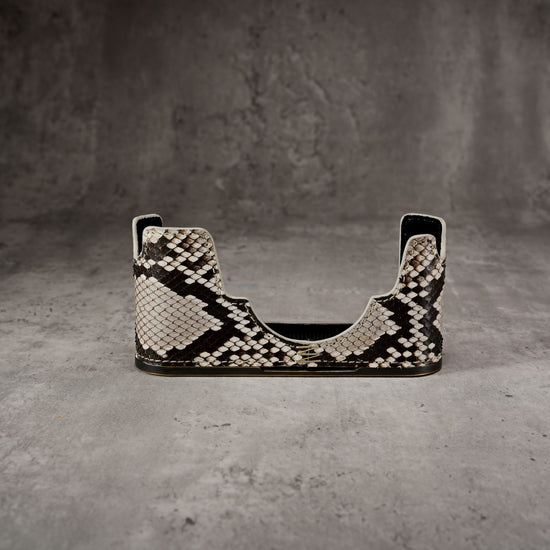 Python FlexCase for the Leica M11 seen from the front, empty, on a grey studio backdrop
