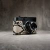 Leica M11 in a Python FlexCase, front three-quarter view with the lens forward