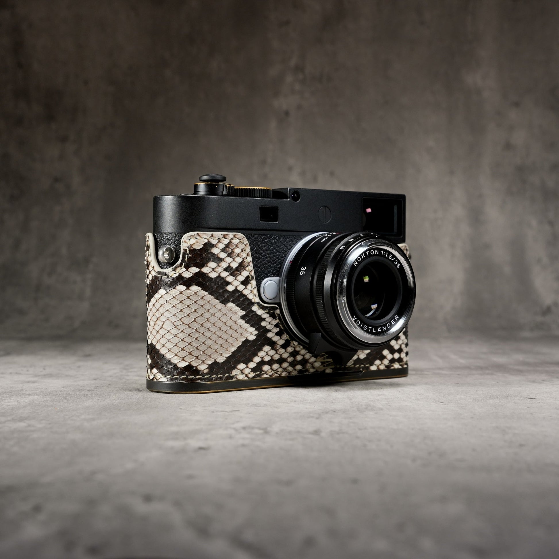Leica M11 in a Python FlexCase, front three-quarter view with the lens forward