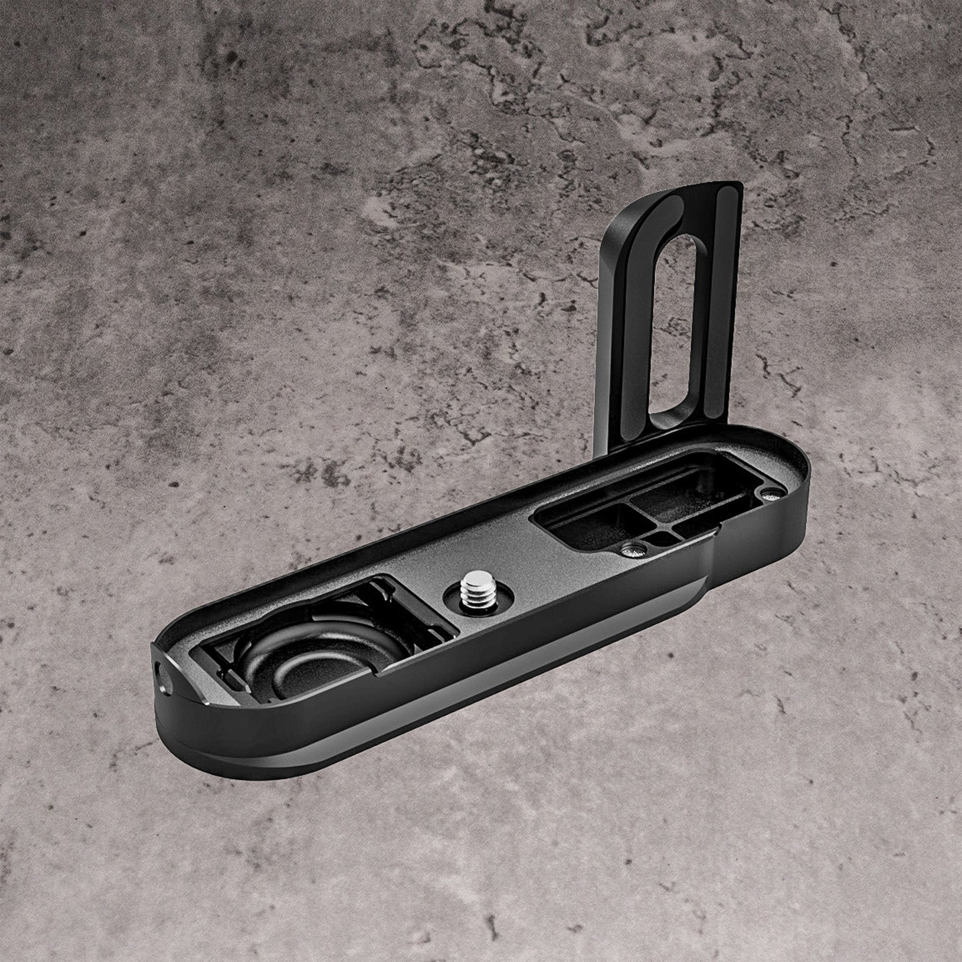 The FlexGrip for the Leica M10 laid flat, showing the interior and the retaining screw