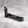 Black Chrome FlexGrip for the Leica M10 on its own, showing the Arca profile and tripod thread