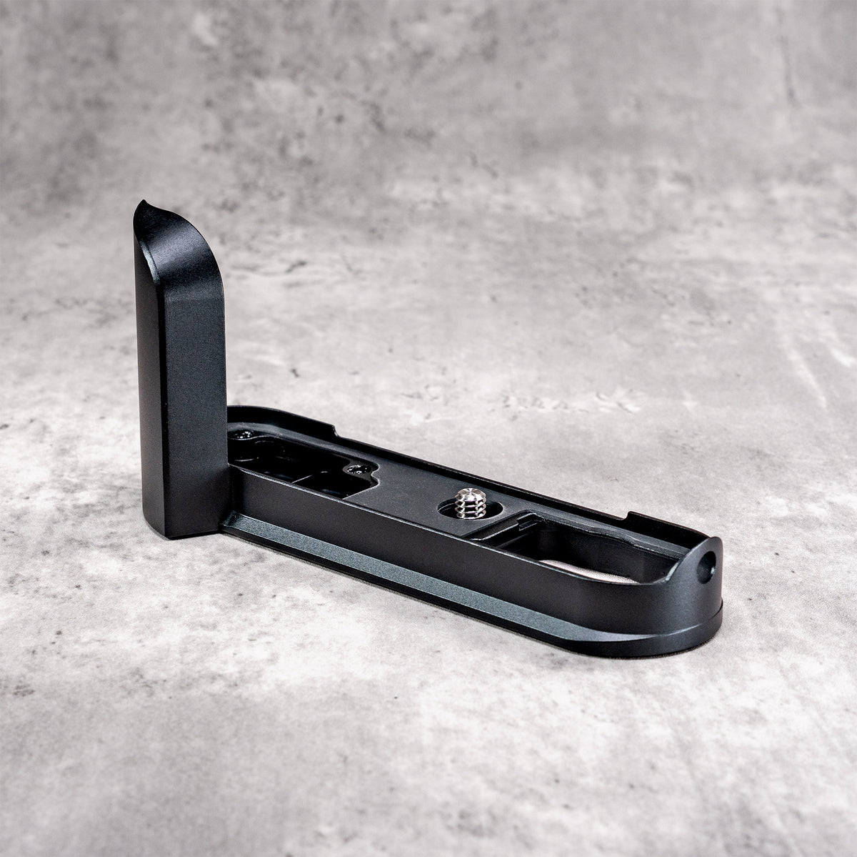 Black Chrome FlexGrip for the Leica M10 on its own, showing the Arca profile and tripod thread