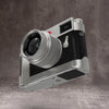 Silver Chrome FlexGrip fitted to a Leica M10, front three quarter view with the lens