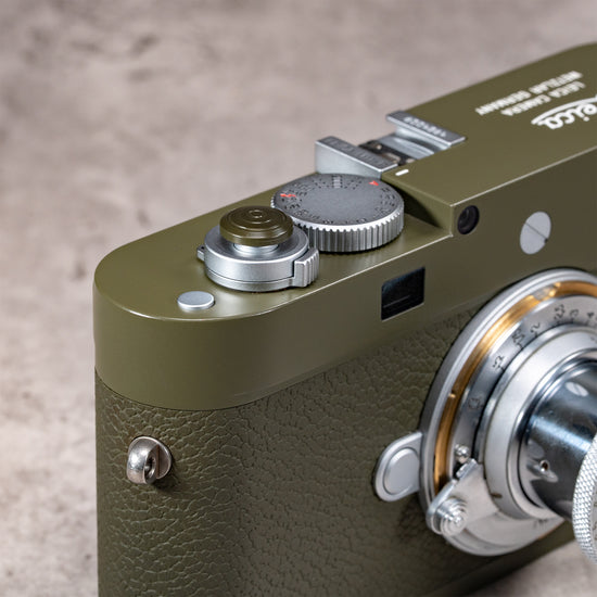 Three quarter view of the Safari Shutter Topper on an olive Leica M