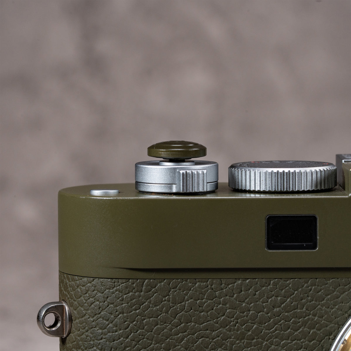Side profile of the Safari anodized Shutter Topper showing its low flush height on a Leica M
