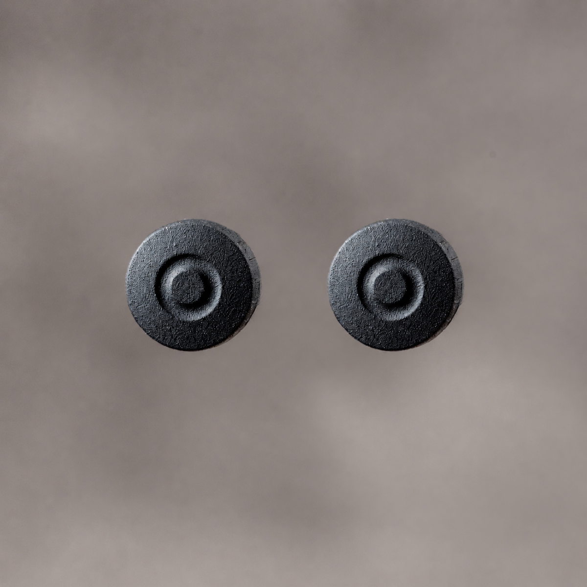 Two Owlkrown Shutter Toppers in Black Cerakote, 7.25 mm, the two pack shown from above