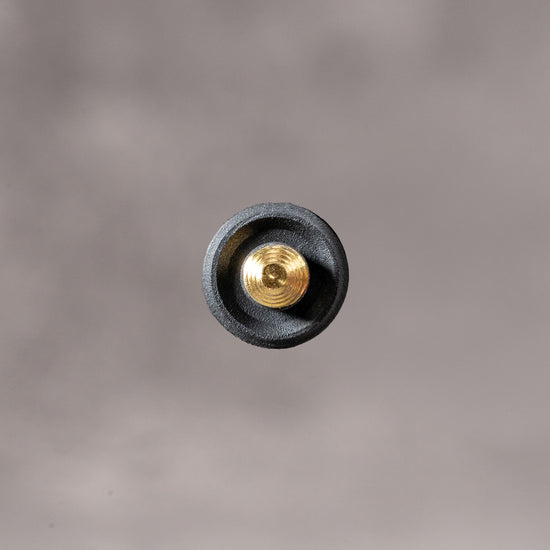 Underside of the Black Cerakote Shutter Topper showing the recessed solid brass thread, 7.25 mm
