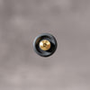 Underside of the Black Cerakote Shutter Topper showing the recessed solid brass thread, 7.25 mm