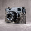 A Leica M11 in the Buffalo SlimCase with the lens focused close
